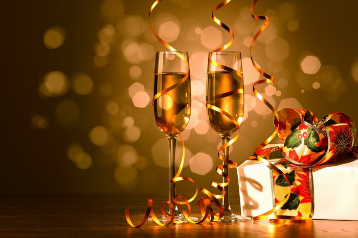 Champagne glasses with ribbon and gift
