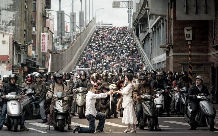 Couple getting engaged in a massive motorcycle traffic jam