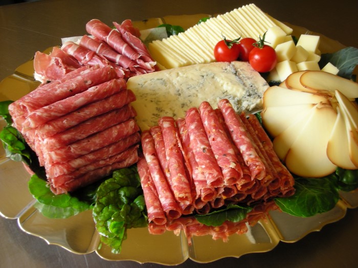 Charcuterie board with cured meats and cheeses