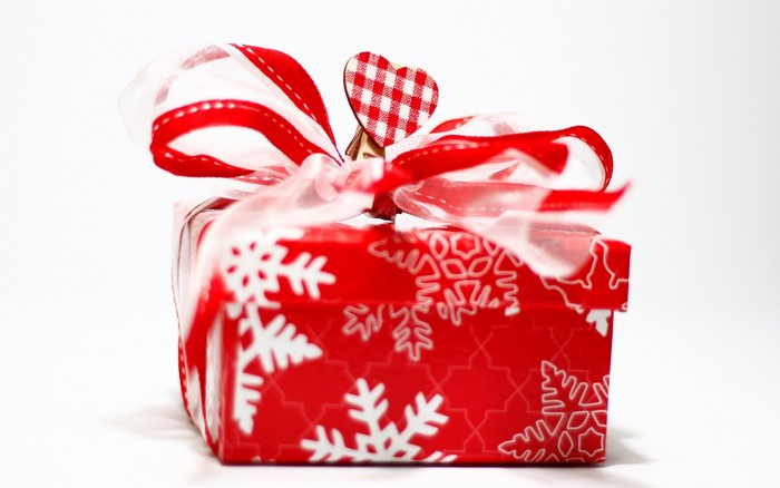 Red Gift Box with Snowflake Pattern and Ribbon