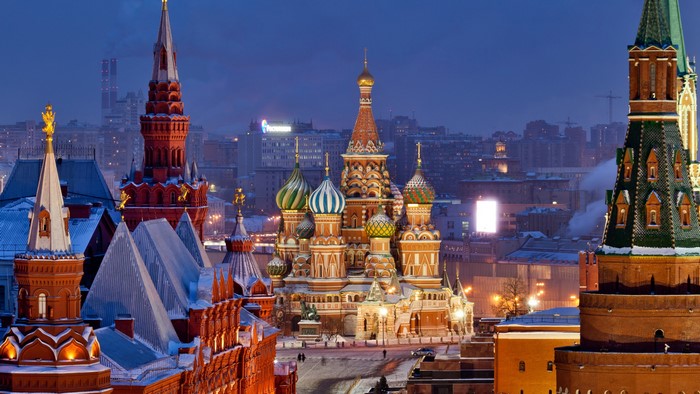 Saint Basil's Cathedral and Kremlin towers in Moscow at dusk