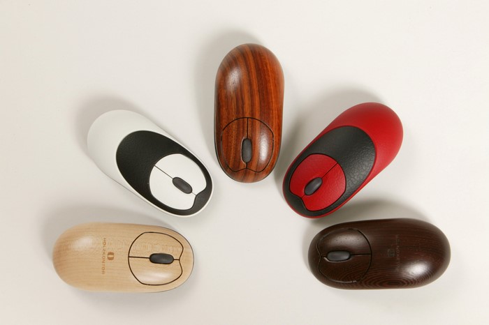 Five computer mice in different colors and materials