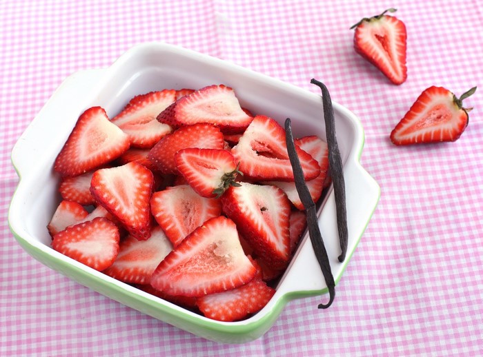 Sliced Strawberries and Vanilla Beans in a Dish