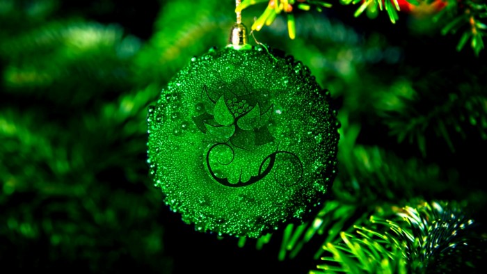 Green Christmas ornament with water droplets and lotus design