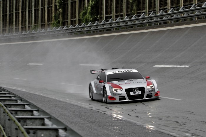 Audi A5 DTM car on a wet race track