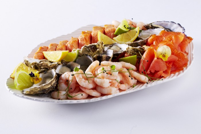 Seafood platter with shrimp, oysters, and smoked salmon