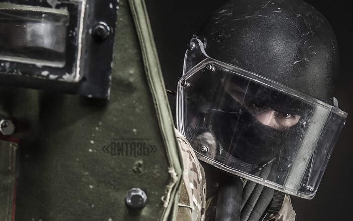Soldier in riot gear with shield