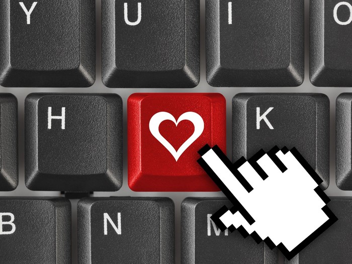 Keyboard with red heart key and cursor