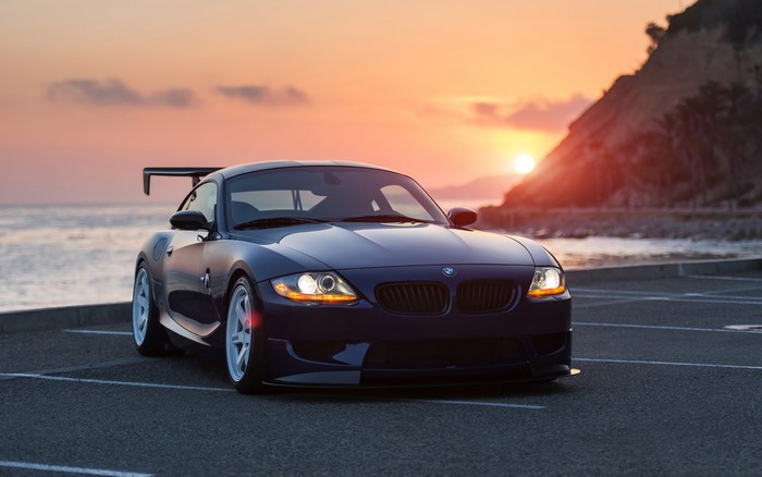 BMW Z4 with a large rear spoiler at sunset