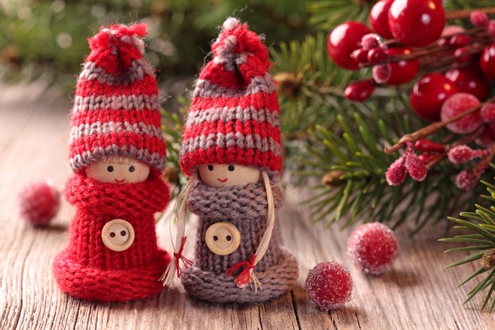 Two knitted Christmas dolls with winter hats