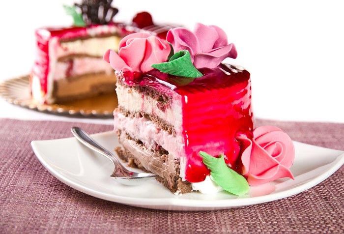 Slice of cake with pink roses