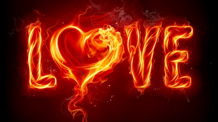The word LOVE formed by fire with a heart shape
