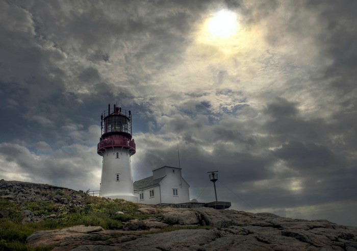 Lighthouse in Norway under cloudy sky