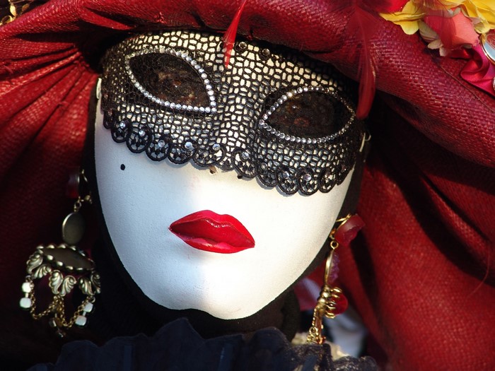 Venetian mask with red lips and black lace
