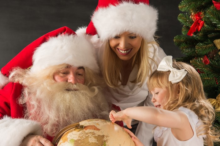 Santa Claus, Woman, and Girl with Globe
