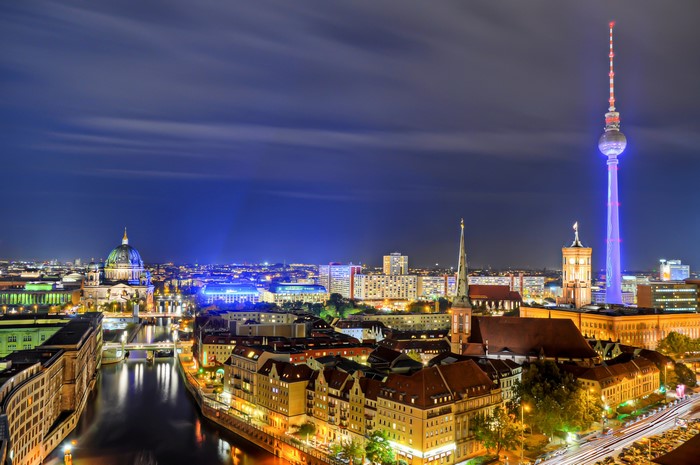 Berlin cityscape at night with TV Tower and Spree River