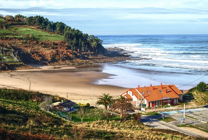 Houses on the coast of Cobreces, Spain overlooking the sea