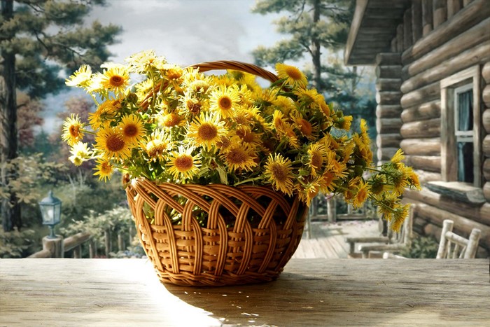 Basket of yellow flowers on a wooden table