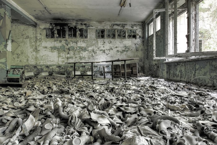 Abandoned room filled with gas masks