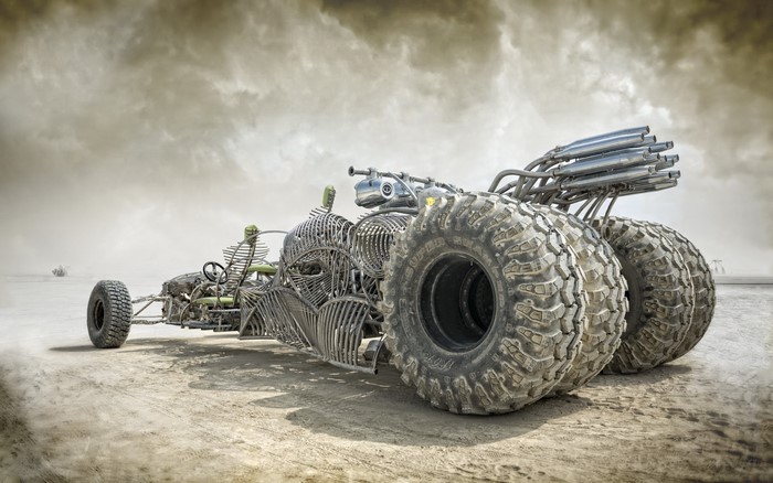 Skeleton-themed buggy with large tires in desert
