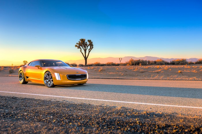 Yellow Kia Stinger GT4 concept car on desert road