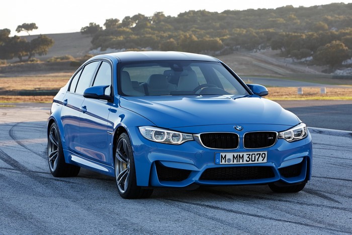 Blue BMW M3 Sedan on a Racetrack