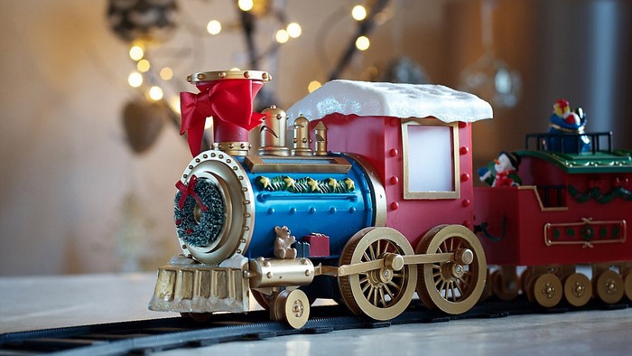 Christmas toy train with red bow and wreath