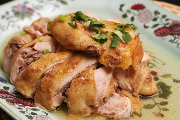 Sliced Roast Chicken with Garnish on a Plate