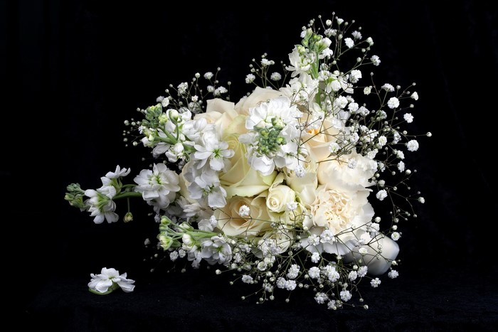White roses and stock flowers bouquet with baby's breath