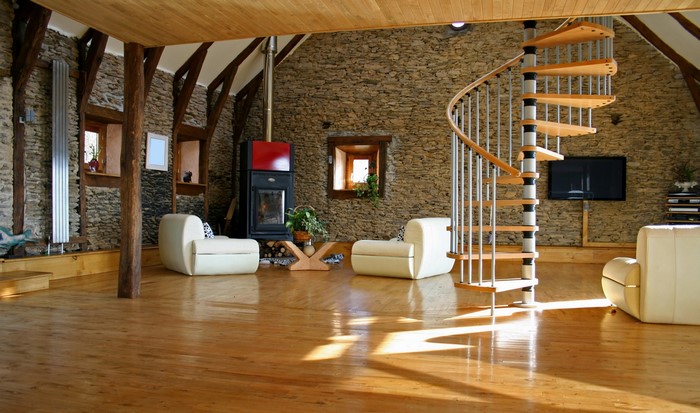 Living room with fireplace and spiral staircase