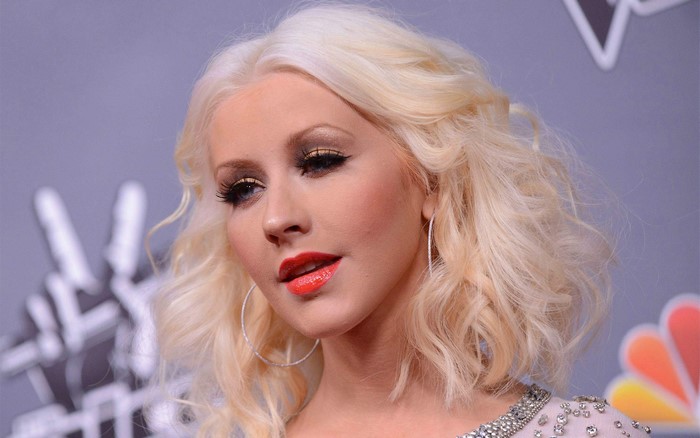 Christina Aguilera with blonde hair and red lipstick