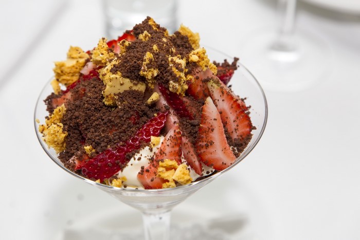 Strawberry dessert with chocolate crumble and honeycomb