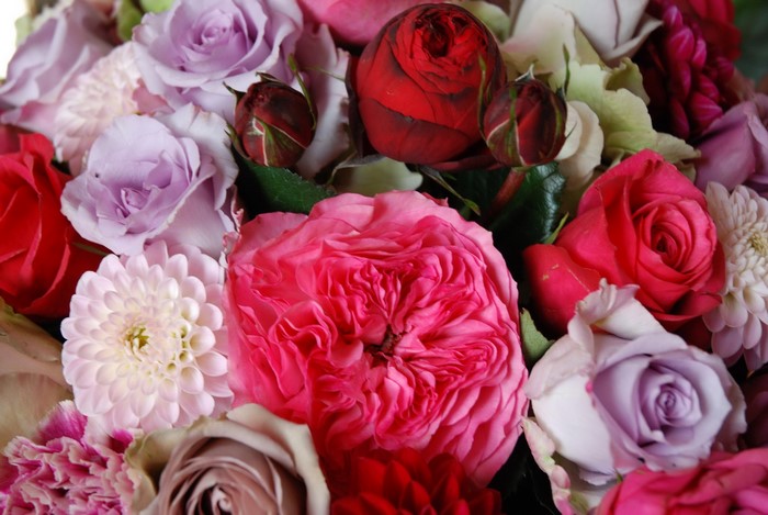 A colorful bouquet of roses and dahlias