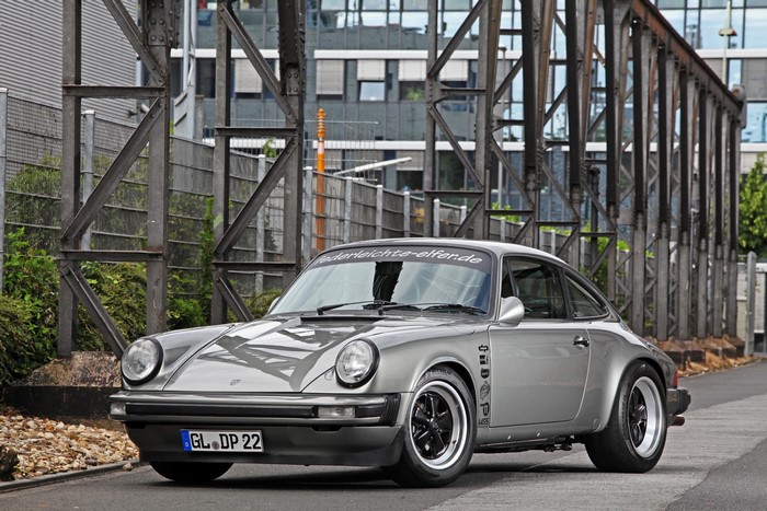 Grey Porsche 911 (DP Motosport) parked outdoors