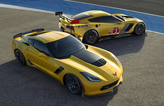 Two yellow Chevrolet Corvette C7 Z06 race cars on a track