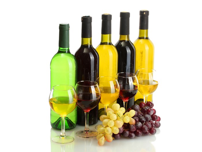 Bottles and glasses of wine with grapes