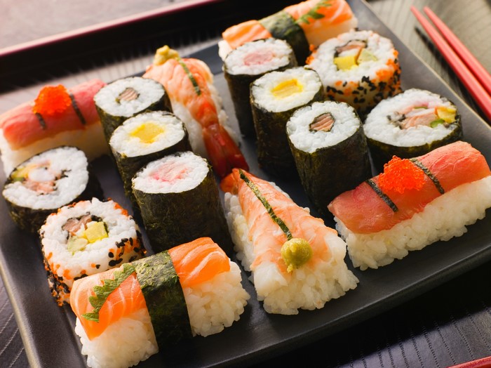 Sushi platter with various rolls and nigiri