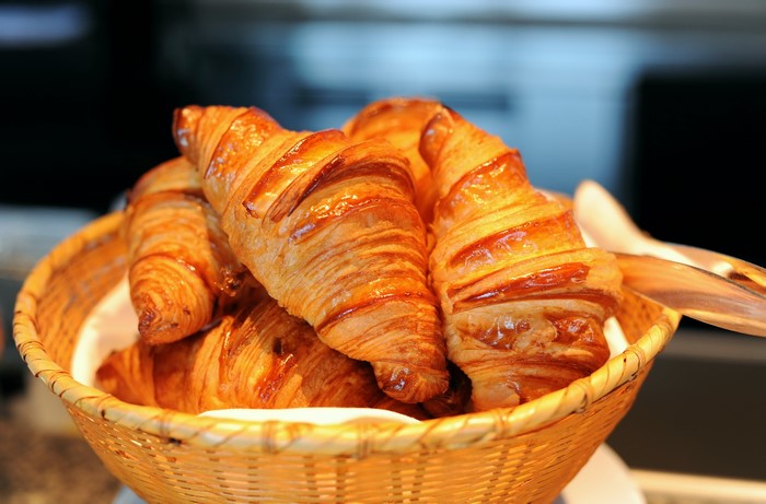Basket of golden croissants