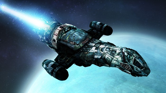 Starship firing a blue beam in space
