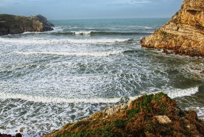 Waves crashing on the rocky coast of Cantabria, Spain