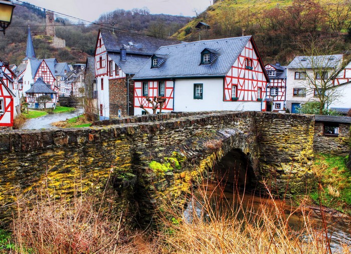 Half-timbered houses and stone bridge in Monreal, Germany