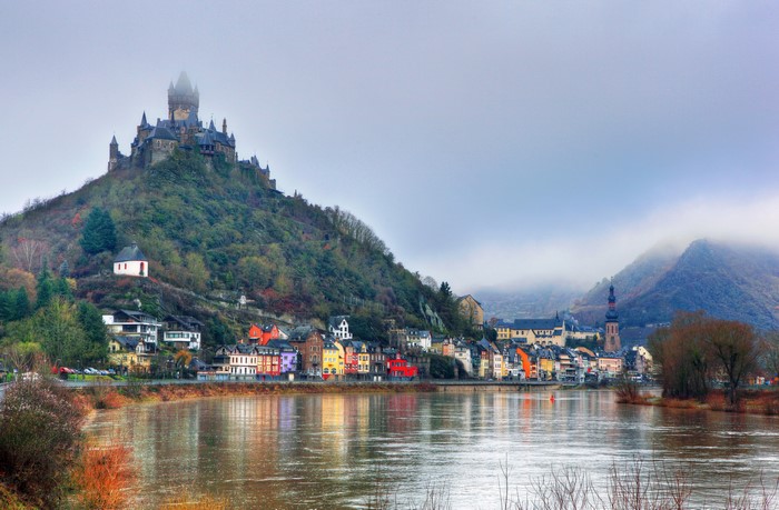 Cochem Castle and colorful houses along the Moselle River in Germany