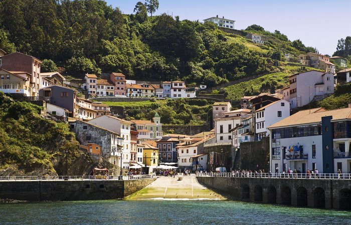 Coastal village with colorful houses on a hillside in Spain
