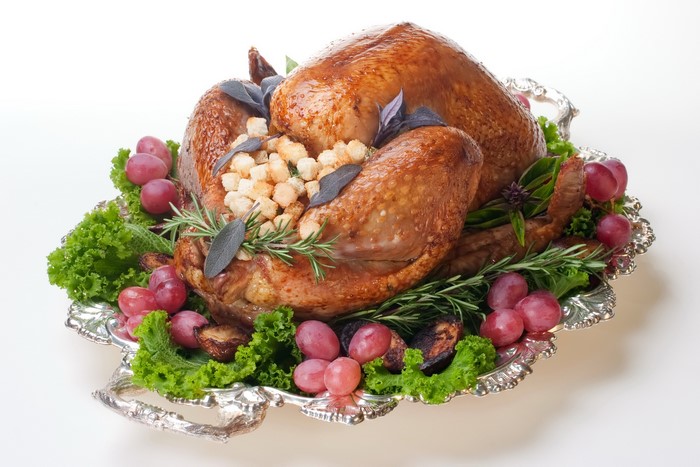 Roasted Turkey with Grapes and Garnish on a Platter