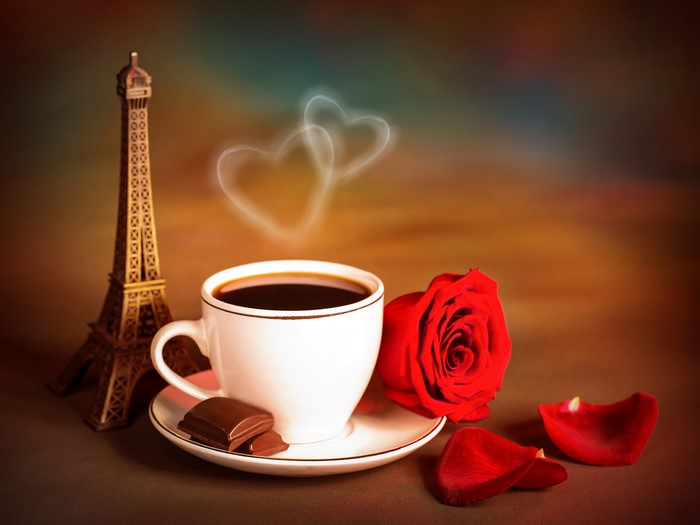 Coffee cup with Eiffel Tower, rose, and chocolate