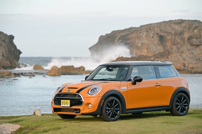 Orange 2014 Mini Cooper S by the coast
