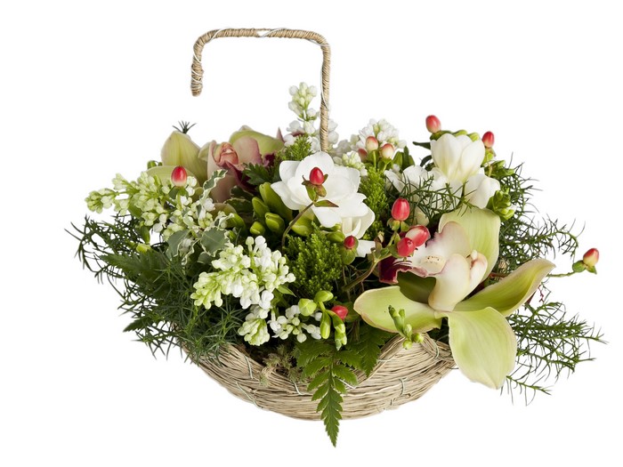 Orchid and Freesia floral arrangement in a wicker basket