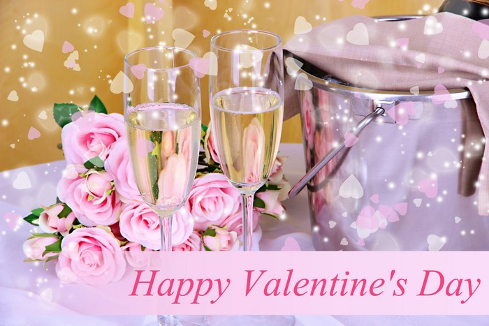 Champagne glasses with roses and ice bucket