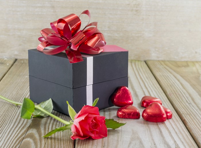 Gift box with red rose and heart chocolates