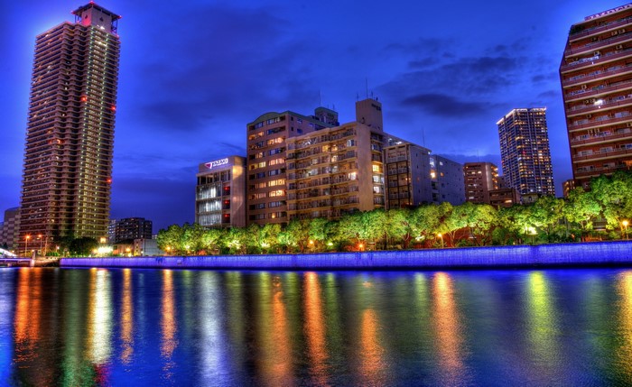 Osaka, Japan riverfront buildings at night